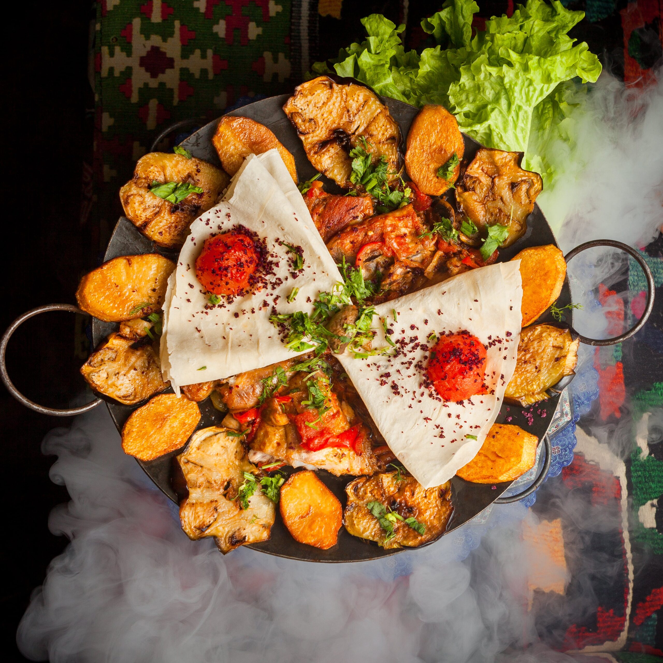 top-view-chicken-sac-with-fried-potatoes-tomato-lavash-smoke-min